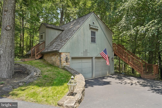 4250 Fretz Mill Rd, New Hope, PA 18938 - view of front of property with stairway, stone siding, and a detached garage