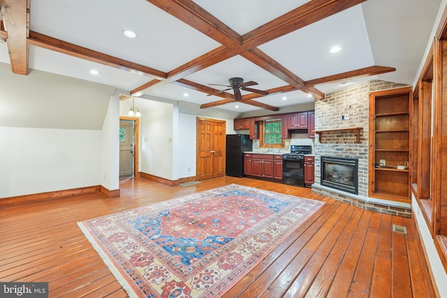 4250 Fretz Mill Rd, New Hope, PA 18938 - living room featuring light wood-style flooring, beam ceiling, a ceiling fan, recessed lighting, and a fireplace