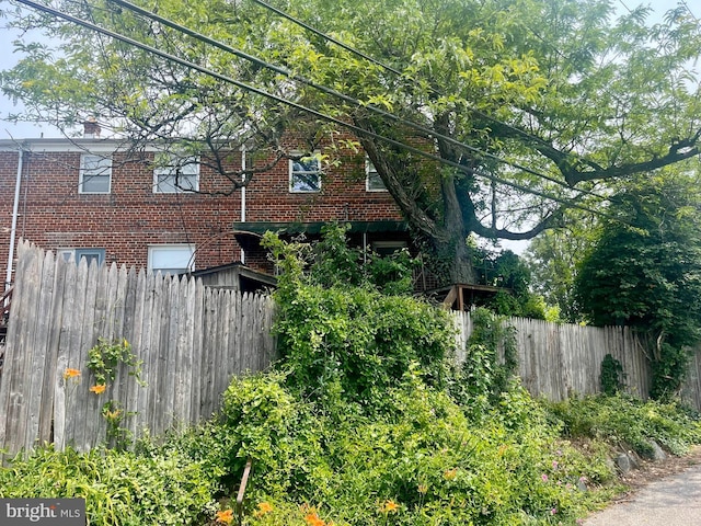 5501 W Forest Park Ave, Baltimore, MD 21207 - view of side of home featuring brick siding