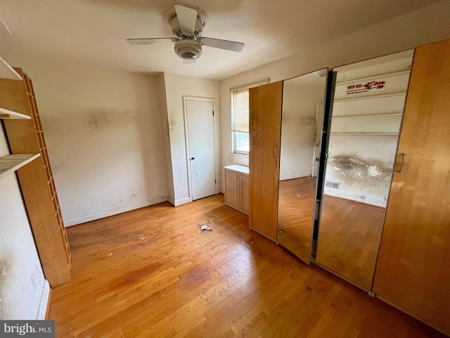 5501 W Forest Park Ave, Baltimore, MD 21207 - unfurnished bedroom with light wood-style floors and a ceiling fan