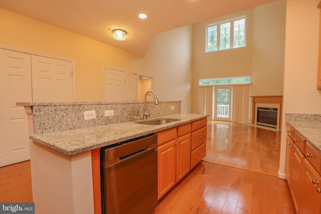 8804 Shining Oceans Way Unit 53, Columbia, MD 21045 - kitchen with dishwashing machine, light wood finished floors, an island with sink, plenty of natural light, and recessed lighting