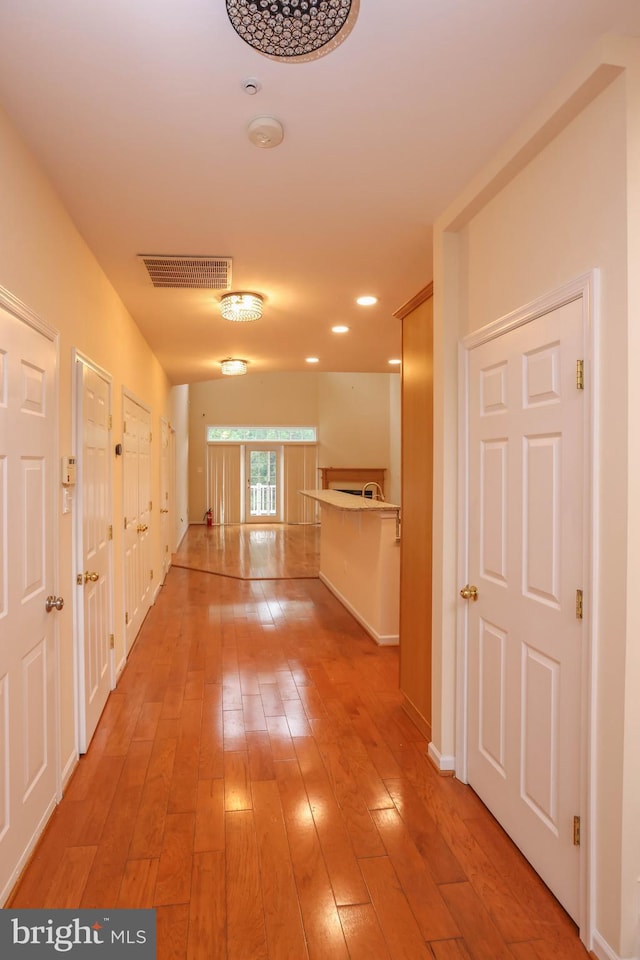 8804 Shining Oceans Way Unit 53, Columbia, MD 21045 - hall featuring light wood-style flooring and baseboards