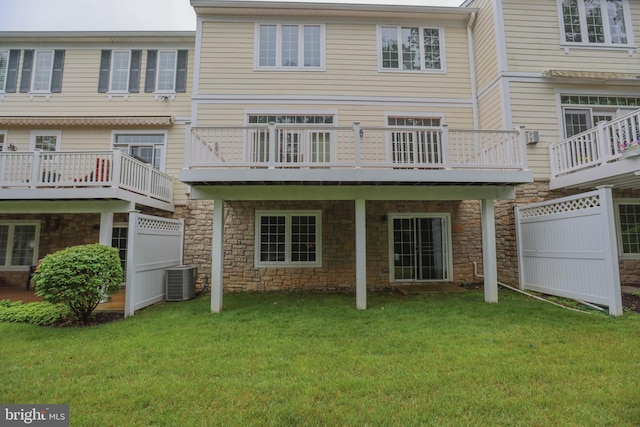 8804 Shining Oceans Way Unit 53, Columbia, MD 21045 - rear view of house with stone siding and a lawn