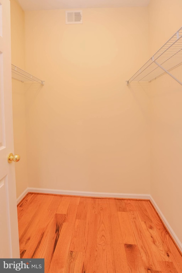 8804 Shining Oceans Way Unit 53, Columbia, MD 21045 - walk in closet featuring wood finished floors