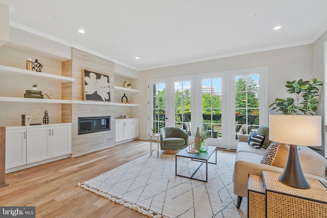 11724 Paysons Way, Reston, VA 20191 - living area with ornamental molding, light wood-style flooring, a premium fireplace, built in features, and recessed lighting