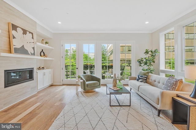 11724 Paysons Way, Reston, VA 20191 - living area with ornamental molding, light wood-type flooring, a fireplace, and recessed lighting