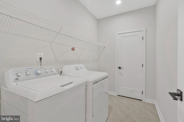 11724 Paysons Way, Reston, VA 20191 - washroom with washing machine and dryer and light tile patterned flooring