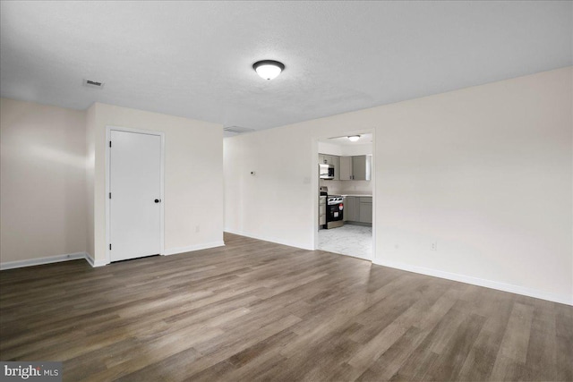 116 Somerset Dr, Stephens City, VA 22655 - unfurnished living room featuring wood finished floors and baseboards