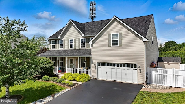 70 Marjessa Dr, Gilbertsville, PA 19525 - traditional home with a porch, a garage, asphalt driveway, and a shingled roof