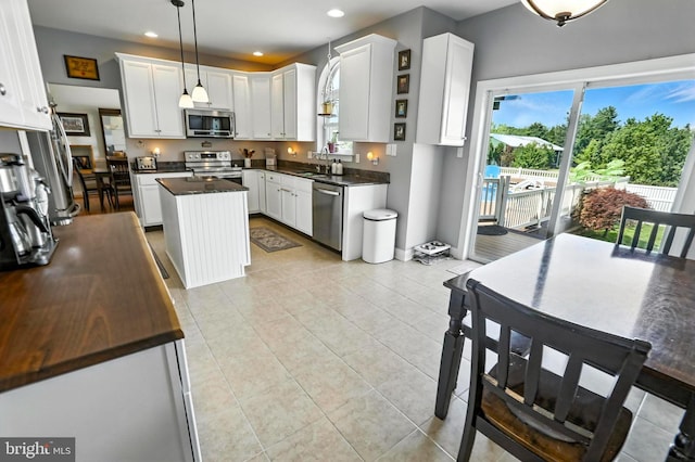 70 Marjessa Dr, Gilbertsville, PA 19525 - kitchen featuring stainless steel appliances, dark countertops, a center island, healthy amount of natural light, and recessed lighting