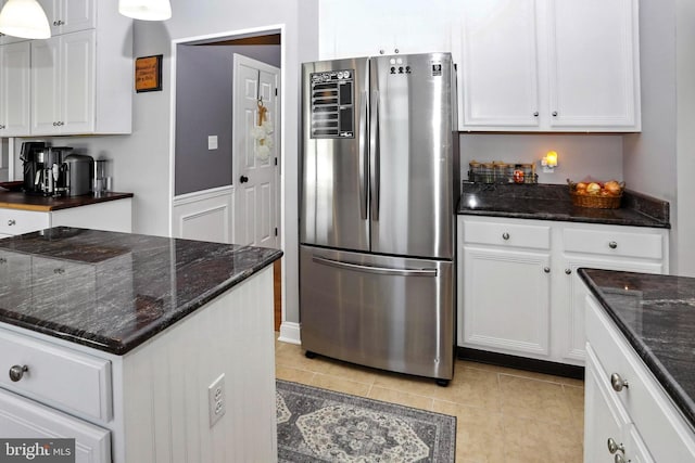 70 Marjessa Dr, Gilbertsville, PA 19525 - kitchen with freestanding refrigerator, white cabinets, light tile patterned floors, and dark stone counters