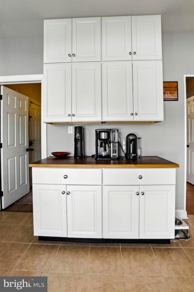 70 Marjessa Dr, Gilbertsville, PA 19525 - kitchen with white cabinetry, light tile patterned flooring, and butcher block countertops