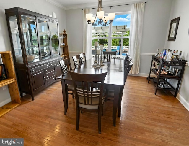 70 Marjessa Dr, Gilbertsville, PA 19525 - dining area with a chandelier, ornamental molding, and light wood-style floors