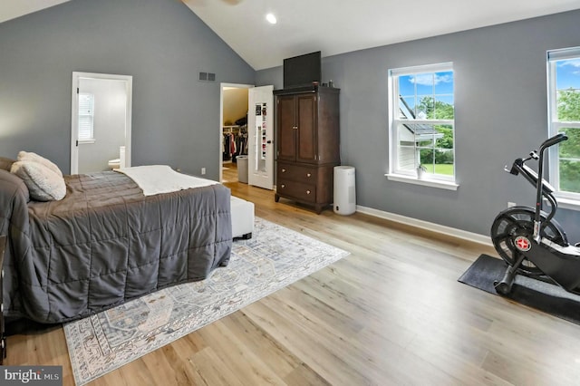 70 Marjessa Dr, Gilbertsville, PA 19525 - bedroom with a walk in closet, wood finished floors, connected bathroom, high vaulted ceiling, and recessed lighting