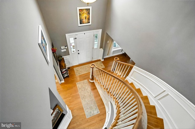 70 Marjessa Dr, Gilbertsville, PA 19525 - foyer with a high ceiling, wood finished floors, stairs, wainscoting, and a decorative wall
