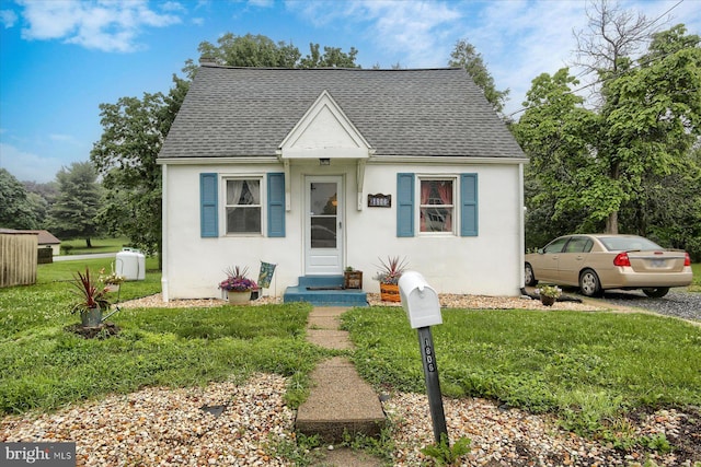 1806 Suncrest Dr, Carlisle, PA 17013 - bungalow with roof with shingles, stucco siding, and a front yard