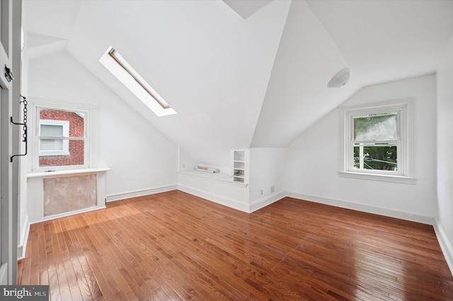 208 Edgemont Ave, Ardmore, PA 19003 - additional living space with vaulted ceiling, a skylight, hardwood / wood-style flooring, and built in features