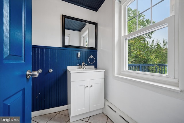 208 Edgemont Ave, Ardmore, PA 19003 - bathroom featuring vanity, healthy amount of natural light, a wainscoted wall, tile patterned floors, and baseboard heating
