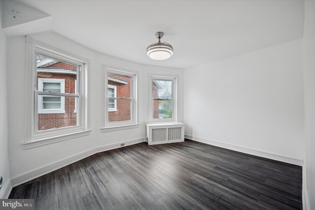 208 Edgemont Ave, Ardmore, PA 19003 - unfurnished dining area featuring radiator heating unit and dark wood-style floors
