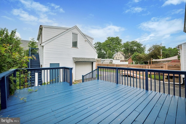 208 Edgemont Ave, Ardmore, PA 19003 - wooden deck with a garage, a fenced backyard, and driveway