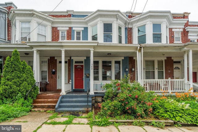 589 N Plum St, Lancaster, PA 17602 - view of property with covered porch and brick siding
