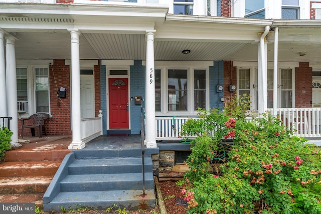 589 N Plum St, Lancaster, PA 17602 - view of exterior entry with covered porch and brick siding