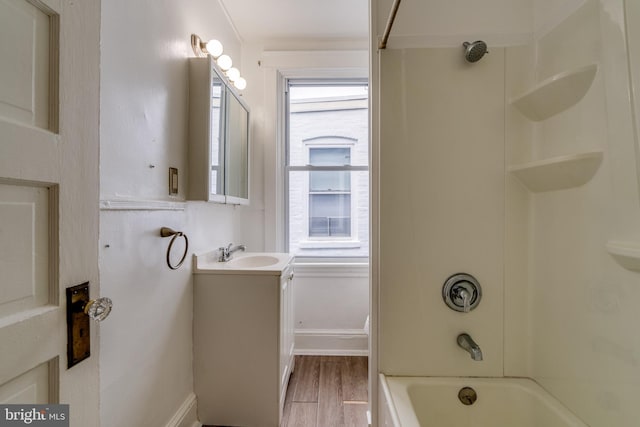 589 N Plum St, Lancaster, PA 17602 - full bathroom with vanity, wood finished floors, and  shower combination