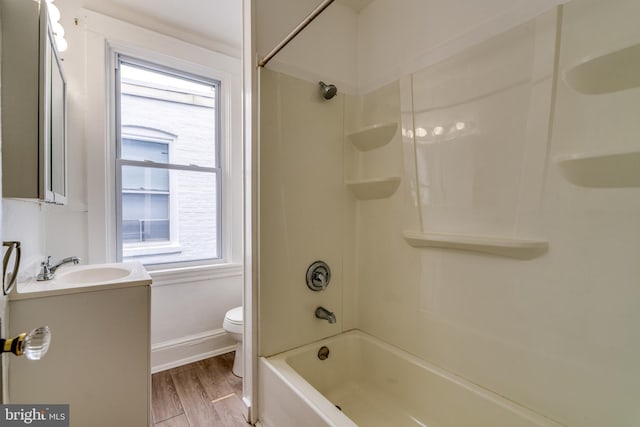 589 N Plum St, Lancaster, PA 17602 - bathroom with vanity, shower / washtub combination, and wood finished floors