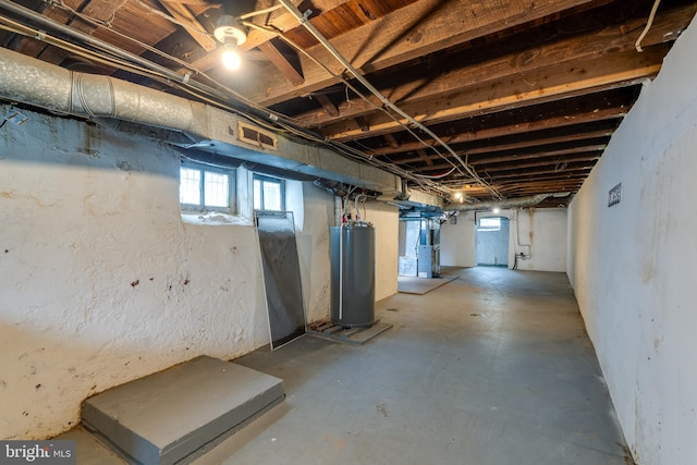 589 N Plum St, Lancaster, PA 17602 - basement featuring water heater, plenty of natural light, and heating unit