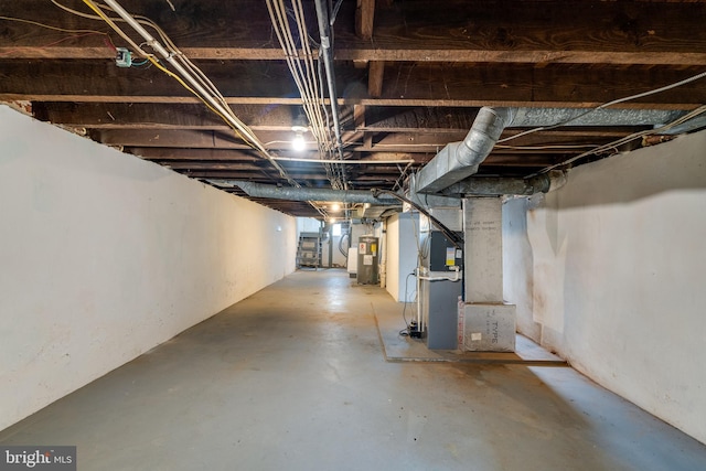 589 N Plum St, Lancaster, PA 17602 - unfinished below grade area featuring electric water heater and heating unit