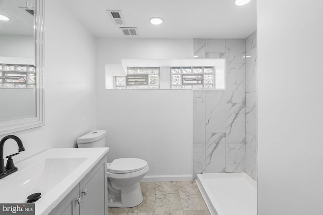 913 E Sanger St, Philadelphia, PA 19124 - full bath with vanity, marble look tiles, a marble finish shower, and recessed lighting