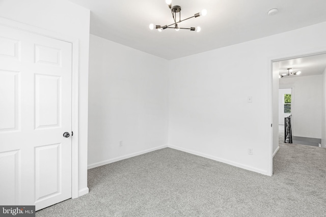 913 E Sanger St, Philadelphia, PA 19124 - spare room featuring a chandelier and carpet floors