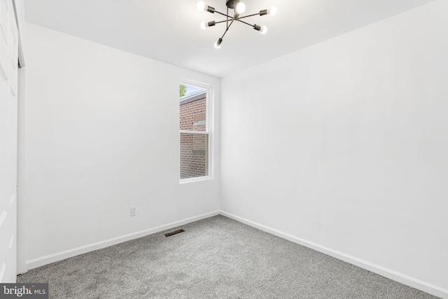 913 E Sanger St, Philadelphia, PA 19124 - unfurnished room with a chandelier and carpet floors