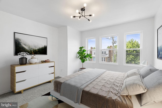 913 E Sanger St, Philadelphia, PA 19124 - carpeted bedroom featuring a chandelier and baseboards
