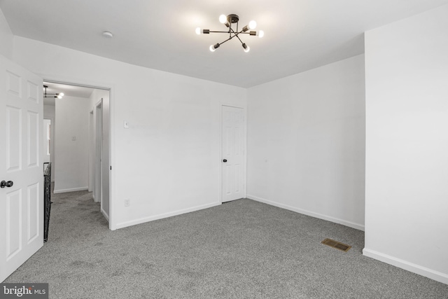 913 E Sanger St, Philadelphia, PA 19124 - spare room featuring a chandelier, carpet flooring, and a smoke detector