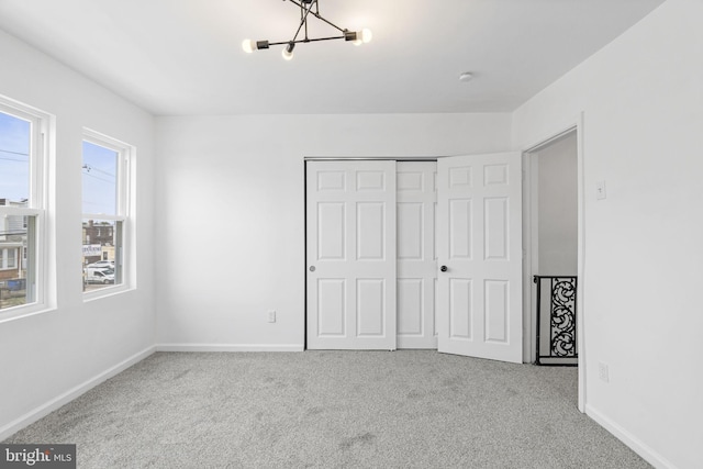 913 E Sanger St, Philadelphia, PA 19124 - unfurnished bedroom featuring a chandelier, carpet, and a closet