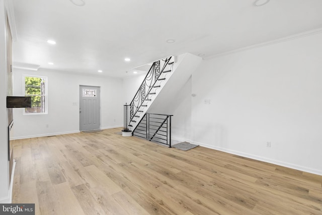 913 E Sanger St, Philadelphia, PA 19124 - unfurnished living room featuring stairway, light wood finished floors, recessed lighting, and ornamental molding