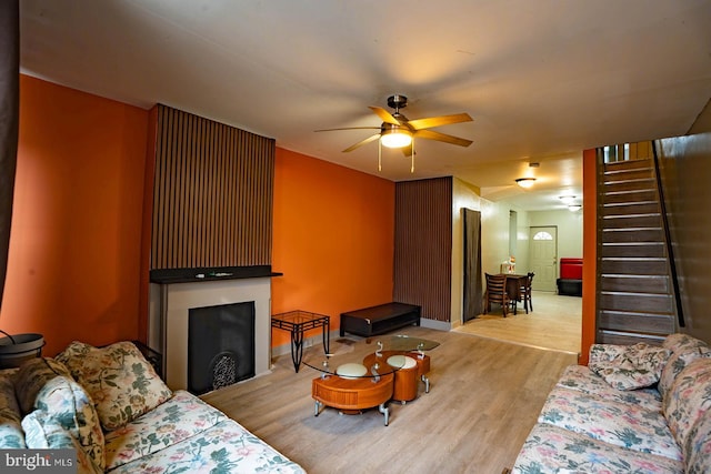 2507 Nicholas St, Philadelphia, PA 19121 - living area with ceiling fan, light wood-type flooring, stairway, and a fireplace