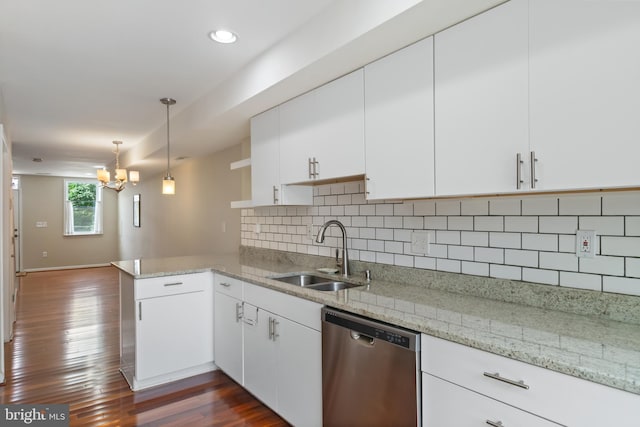 3343 Paine St, Baltimore, MD 21211 - kitchen with dishwasher, a peninsula, a chandelier, white cabinets, and decorative backsplash