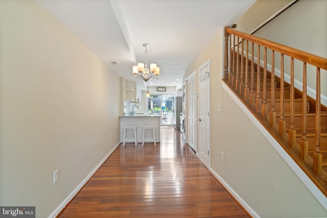 3343 Paine St, Baltimore, MD 21211 - entryway featuring a chandelier, hardwood / wood-style flooring, and stairs