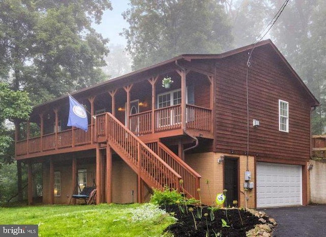 214 Salt Lick Rd, Front Royal, VA 22630 - view of front of home with an attached garage, stairs, asphalt driveway, and a front lawn