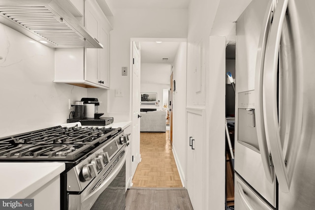 1811 19th St NW Unit 2, Washington, DC 20009 - kitchen featuring stainless steel appliances, custom exhaust hood, white cabinetry, and light countertops