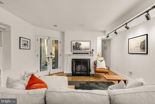 1811 19th St NW Unit 2, Washington, DC 20009 - living area with rail lighting, french doors, and a fireplace