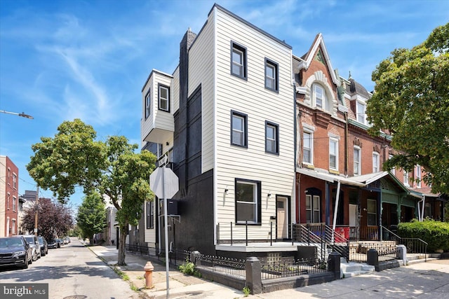 4063 Spring Garden St, Philadelphia, PA 19104 - view of property with covered porch and a fenced front yard