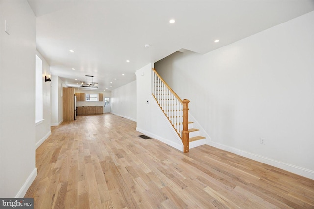 4063 Spring Garden St, Philadelphia, PA 19104 - unfurnished living room featuring stairway, light wood-type flooring, and recessed lighting