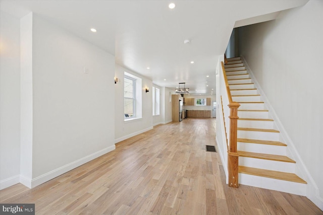 4063 Spring Garden St, Philadelphia, PA 19104 - unfurnished living room featuring stairs, recessed lighting, and light wood-style floors