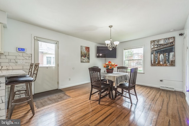 1622 Amosland Rd, Prospect Park, PA 19076 - dining room featuring hardwood / wood-style flooring and a chandelier