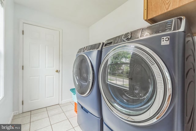 1622 Amosland Rd, Prospect Park, PA 19076 - laundry area with washer and clothes dryer and light tile patterned flooring