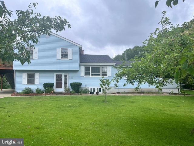 399 Hilltop Ln, Annapolis, MD 21403 - tri-level home with a front lawn and roof with shingles