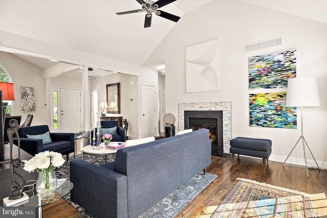 112 W Shore Dr, Milton, DE 19968 - living room featuring a ceiling fan, decorative columns, a tiled fireplace, wood finished floors, and high vaulted ceiling